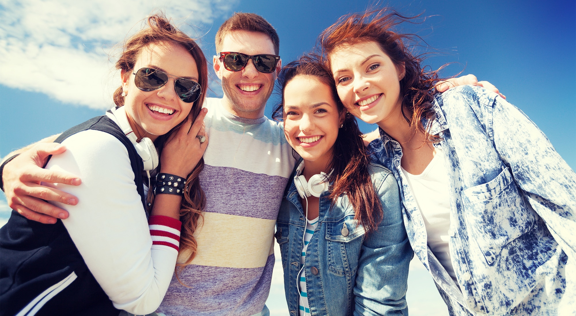 summer holidays and teenage concept - group of teenagers outside