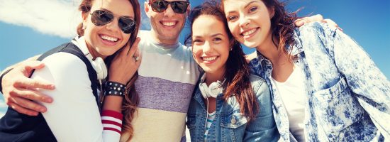 group of teenagers outside summer holidays and teenage concept - group of teenagers outside